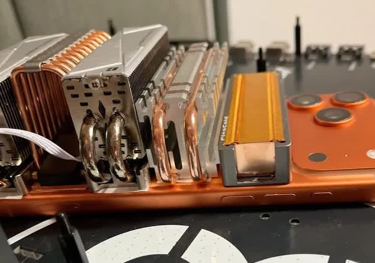 Modder attaches SSD coolers to iPhone 17 Pro Max for unprecedented benchmark results - In-Depth R...